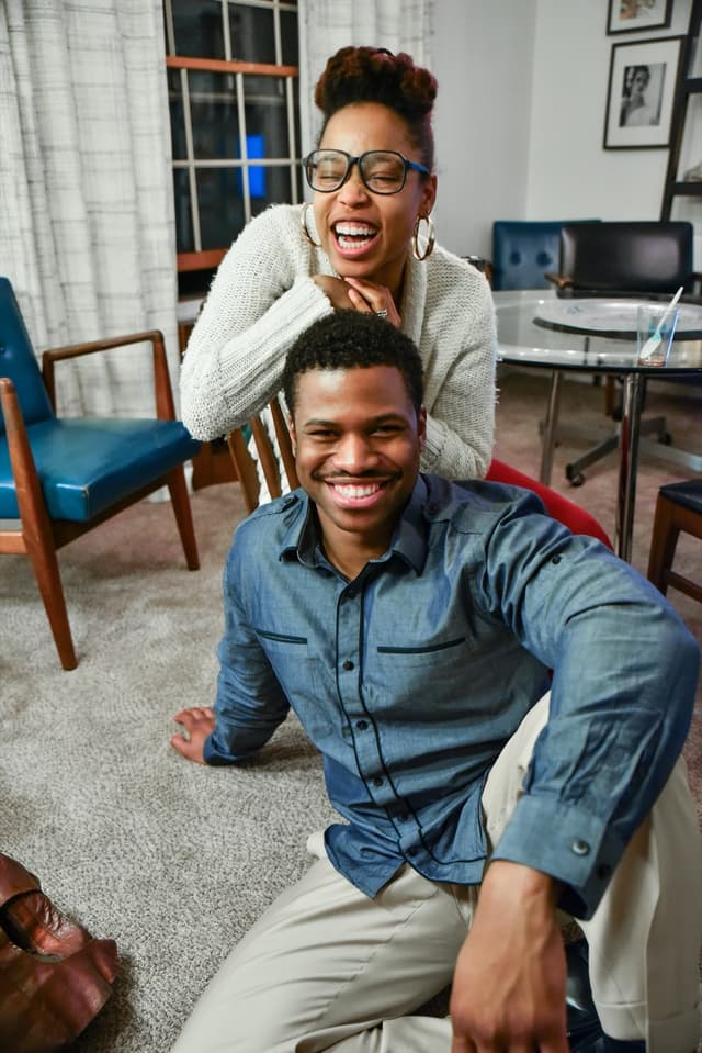 A happy couple attending couples therapy and premarital counseling.